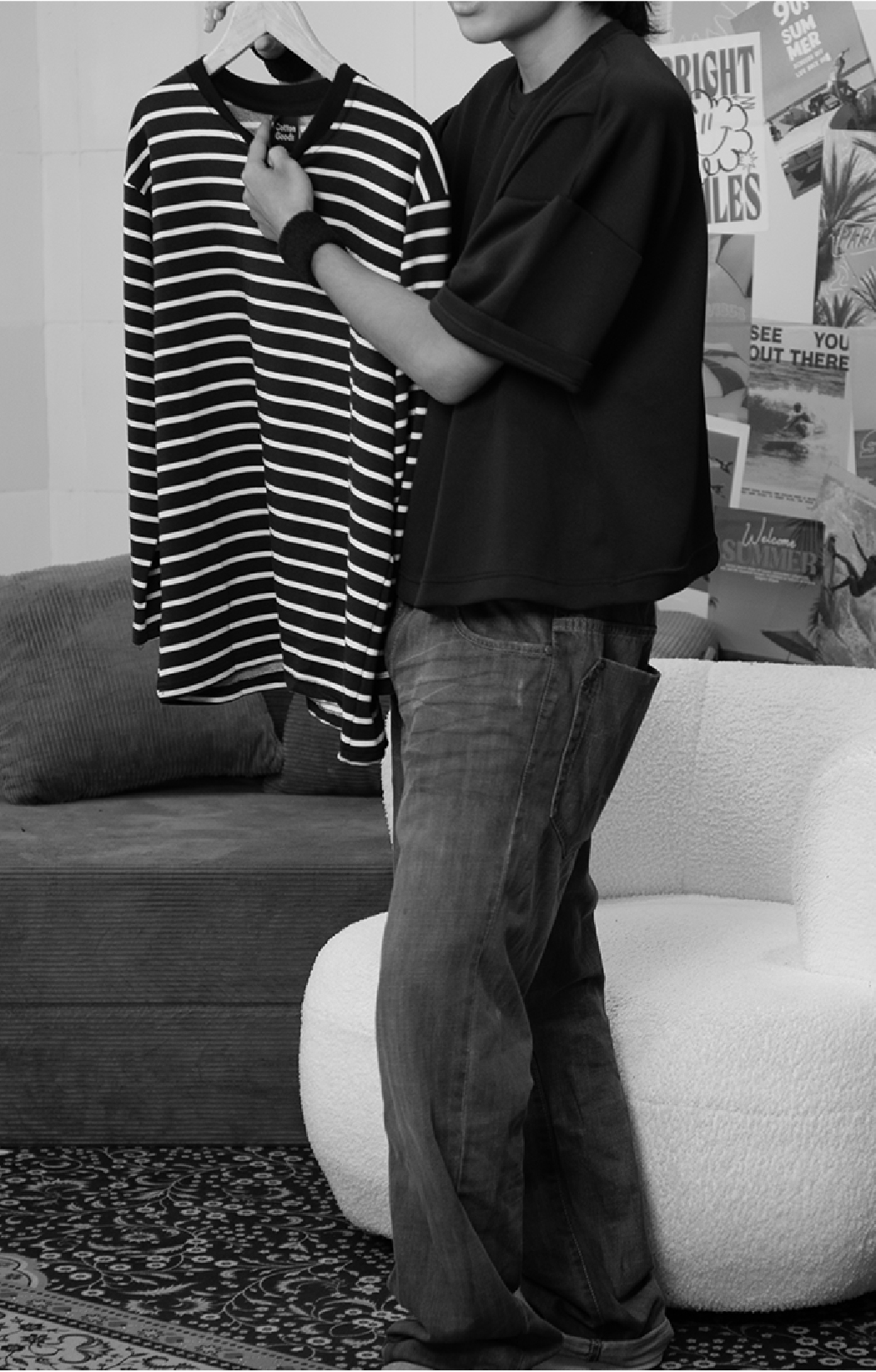 Holding shirt pointing shirt